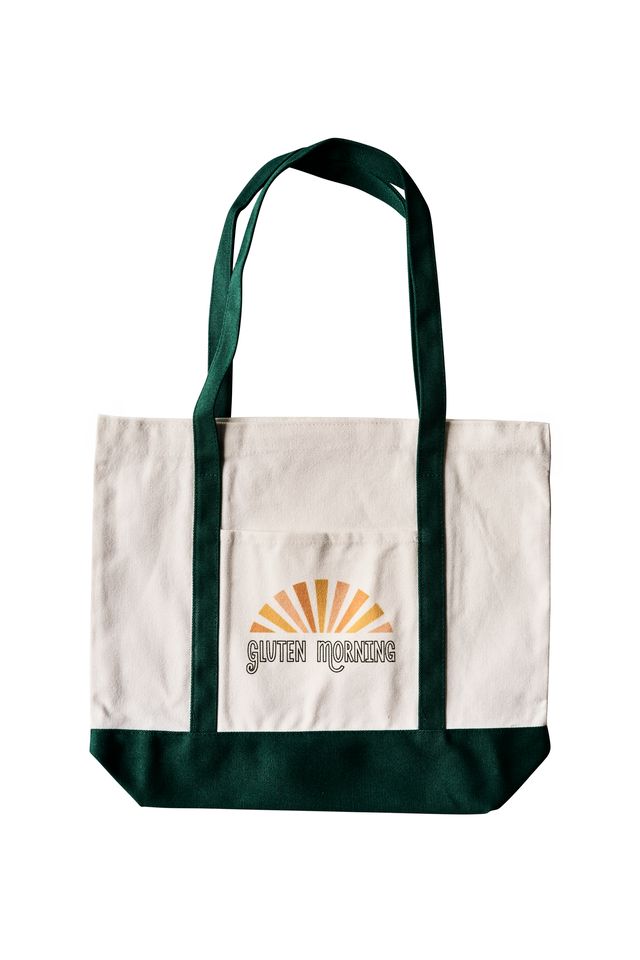 Green canvas tote bag with front pocket